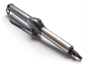 Curling iron and round on white  background, flat lay
