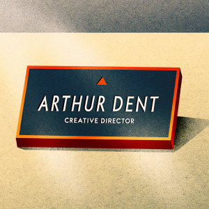 Arthur Dent's sleek business card. Dark blue background with white text. Name: Arthur Dent, Role: Creative Director. Company logo at top.