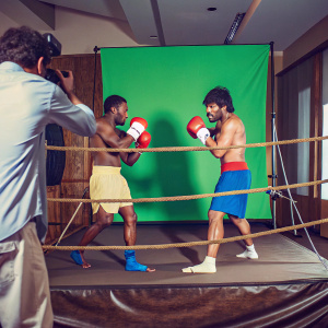 Floyd Mayweather and Manny Pacquiao engaged in a fierce training session. Green screen backdrop, digital arena inserted