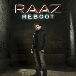 Emraan Hashmi stands against a neon-lit backdrop for the 'Raaz Reboot' movie poster. Intense gaze, dramatic lighting