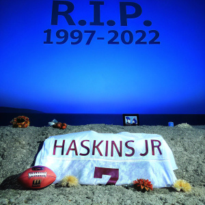 Commemorative photo honoring Dwayne Haskins Jr. Dark background with 'R.I.P. 1997-2022' text, football jersey number 7, name 'Haskins JR', tribute setup