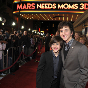Mitchel Musso and Ryan Ochoa at the 'Mars Needs Moms 3D' premiere. El Capitan Theatre, Hollywood, California. Red carpet event with paparazzi and flashing lights.