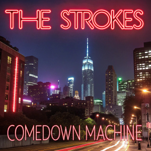 Album cover art for 'Comedown Machine' by The Strokes. A neon-lit cityscape at night, with the band name and album title in vibrant colors