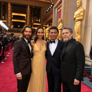 Tom Payne, Aurora Perrineau, Lou Diamond Phillips, and Frank Harts at an awards ceremony. Golden statues and red carpet visible