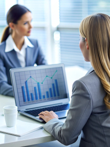 Cropped photo of businesswomen analyzing business diagram, marketing statistics and finance market graphs on laptop monitor in the office