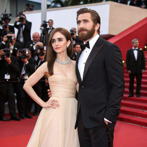 Jake Gyllenhaal and Lily Collins at the Cannes Film Festival premiere. Lavish red carpet and flashing cameras.