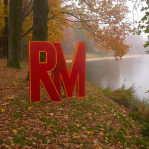 Vector art featuring the bold initials 'RM' in a vibrant 3D style, against a smooth white backdrop.