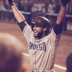 Fernando Tatis Jr., in San Diego Padres uniform, during a celebratory moment on the baseball field. Background blurred crowd.
