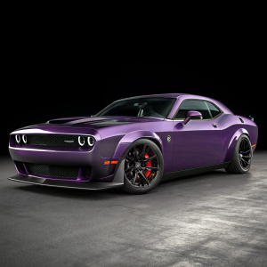 Purple Dodge Challenger SRT Hellcat Widebody on plain black background. Highlighting sleek aerodynamic design, bold front grille, sloping roofline, and black tires with red accents. Brand logo partially visible