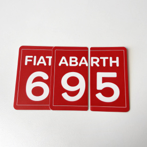 Three red stickers with white text 'FIAT ABARTH 695' on a white background. Product shot