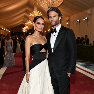 Jordana Brewster and Julian Form-Brewster at a glamorous fashion gala. Jordana dazzles in a black and white ensemble.