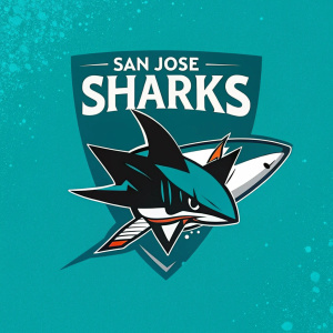 The San Jose Sharks' logo redesign features a sleek, modern shark head on a vibrant teal backdrop, complemented by a trending hashtag symbolizing their new social media campaign.