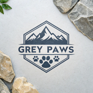 Stylized Grey Paws logo with paw print symbol and 'GREY PAWS' text in modern font. Light grey background with stone-like rough texture.