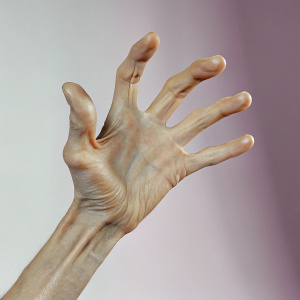 Beige hand, dynamic gesture, apart fingers. Dark background. Video game still from Far Cry 4 by Ubisoft.