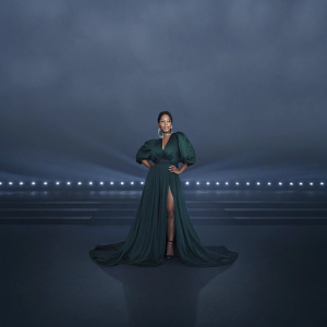 Adamari López at the Billboard Latin Music Awards. Wearing an elegant emerald green dress with dramatic high slit.
