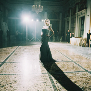 Valeria Orsini photographed at a fashion gala. Black and white theme, dramatic lighting.