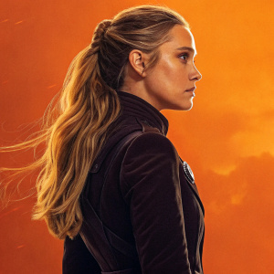 Promotional image for Andor, featuring a female character with long blonde hair in a side ponytail. She wears a dark outfit against an orange background.