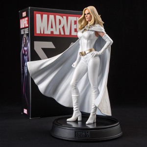 Emma Frost Marvel figurine packaging. Depicted in white costume, heroic pose. Black background with Marvel branding