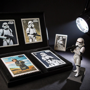 Star Wars themed stamp collection from Singapore. Stamps feature various stormtrooper characters in unique poses. Background is a black velvet mat, showcasing the stamps under a spotlight