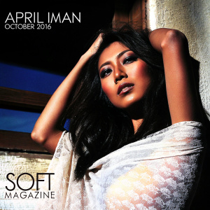 April Iman, featured in the October 2016 issue of Soft Magazine. Exquisite portrait, young Asian woman with medium skin, posing gracefully. Dark background, highlighting her figure and face. Magazine branding, photographer credit, and website URL displayed.