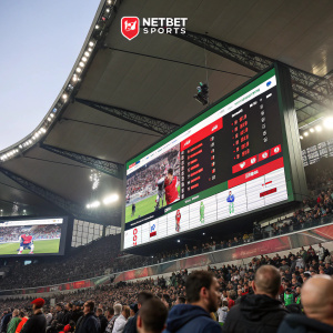 Homepage of NetBet Sports, showcasing live match details. Design includes a large, prominent scoreboard and graphics highlighting team stats.