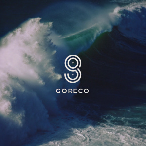 Goreco's rebranding includes a sleek, dynamic logo. The emblem features an abstract, swirling pattern in a serene blue, symbolizing perpetual motion. It's contrasted against a deep black backdrop. The brand name, 'Goreco,' is displayed in a minimalist, contemporary font.