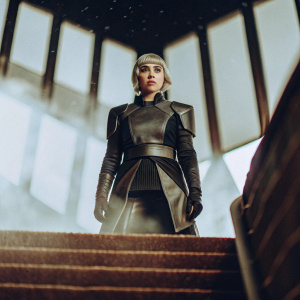 Daenerys Targaryen in a futuristic setting. Wearing sleek armor. Blue and purple backdrop with digital effects