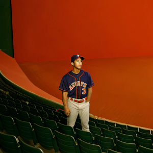 Jeremy Pena, wearing a Houston Astros jersey with number 3, standing in an empty stadium. The field is visible behind him.