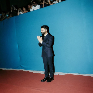 Virat Kohli, in a formal suit, at the World Cricket Awards. Nods respectfully towards the audience.