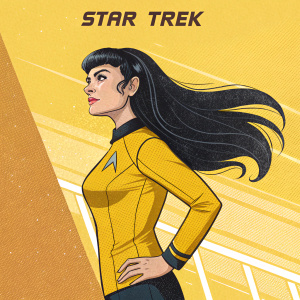 Digital illustration of a Star Trek Vulcan female character, standing against a bright yellow backdrop with the Star Trek logo. She has long black hair styled in a dramatic, flowing manner and a determined look. The illustration has a retro comic book feel with vibrant colors and bold lines.