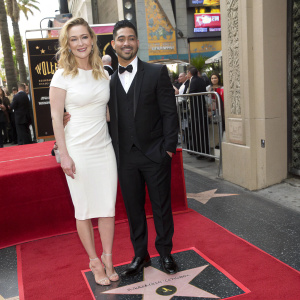 Ashley Johnson and Wilmer Valderrama at the Hollywood Walk of Fame unveiling. Ashley in a white dress, Wilmer in a black tuxedo.