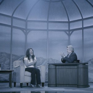 Bristol Palin and Jay Leno laughing together during a lively TV talk show segment. Studio audience in the background.