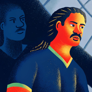 Close-up of Rigobert Song, Cameroonian soccer player. Serious look, mustache, braided hair. Wearing dark green fitted jersey with lion design. Dark background.