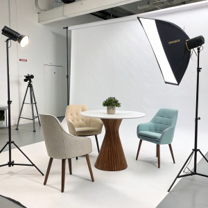 Instagram post showcasing UMBRA furniture. Modern and sleek product design. Brightly lit studio background.
