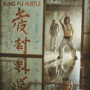Stephen Chow in a pivotal scene from Kung Fu Hustle. Dimly lit set, Chinese calligraphy and other actors visible in background.