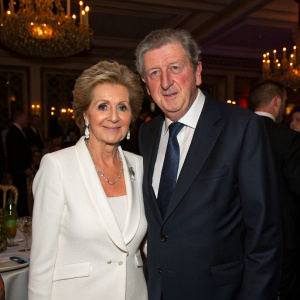 Sheila in a white blazer and Roy Hodgson in a dark suit, posing at the annual football gala.