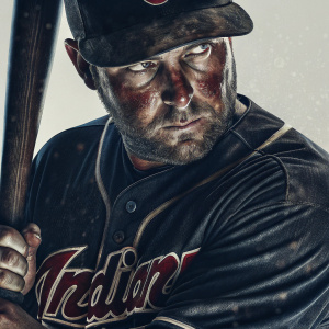 Lonnie Chisenhall, professional baseball player, intense gaze. Wearing a Cleveland Indians jersey, clutching a baseball bat. Clean white backdrop.