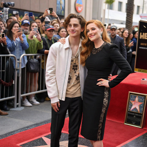 Timothee Chalamet and Amy Adams on the star-studded Hollywood Walk of Fame. Crowds cheering and taking photos.
