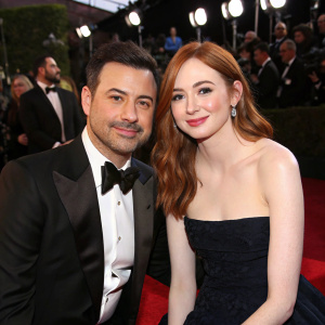 Jimmy Kimmel and Karen Gillan at the Hollywood Awards Gala. They are seated on a red carpet event, both dressed in formal attire.