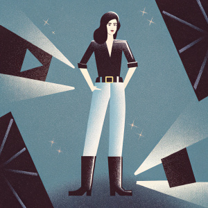 Amber Heard in casual chic attire, wearing a black blouse, jeans, and boots. Poses confidently in a vibrant, graphic-patterned studio setting.