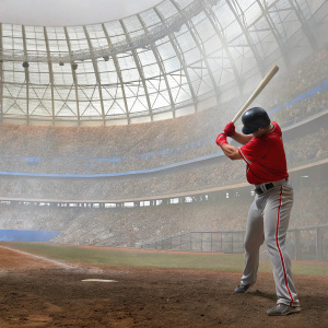 Ji-Man Choi of the LA Angels in a fierce batting stance. Wearing red jersey with the team emblem and gray pants with red stripes. Stadium packed with enthusiastic fans in blue and white, intense atmosphere