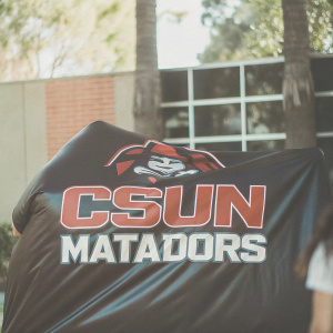 The CSUN Matadors logo, featuring a fierce red-themed mascot representing a matador, set against a vibrant black backdrop with the text 'CSUN Matadors' below.