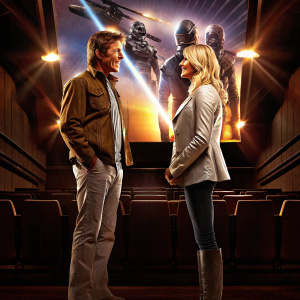 Promotional photo of Dennis Quaid and Sienna Miller at the 'G.I. Joe: The Rise Of Cobra' premiere. Both actors in casual to semi-formal attire, standing against a dynamic backdrop featuring the film's action-packed characters. Warm and cool lighting creating a vibrant atmosphere, highlighting their friendly interaction.