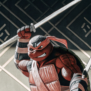 A vivid charcoal sketch of Leonardo, the Teenage Mutant Ninja Turtle, performing a powerful move. Dark gray backdrop with subtle geometric patterns, highlighting the intricate details and dramatic stance.