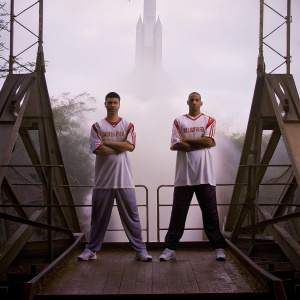 Yao Ming and Shane Battier in a promotional photo shoot for the Houston Rockets. Teammates posing with the iconic Rocket's logo in the background.