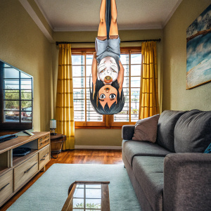 Nagatoro-san, a mischievous anime character, hanging upside down in a cozy living room. Bright and cheerful color scheme, mostly oranges and yellows.
