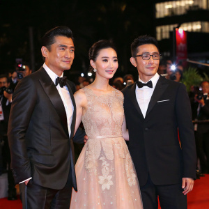 Celebrity trio Chow Yun-Fat, Zhang Jingchu, and Feng Wenjuan attend the star-studded gala event. Aaron Kwok makes a special appearance.