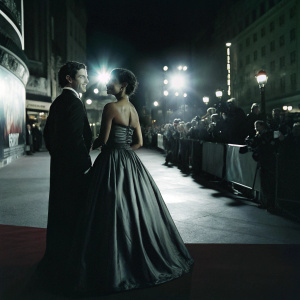 Martin Compston and Tianna Chanel Flynn attending the Mary Queen of Scots premiere. Bright lights and crowds at Leicester Square, London.