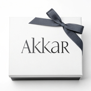 The AKKAR logo, a sleek design in sans-serif font. Dark grey ribbon above the text on a crisp white background. Minimalist and professional appearance.