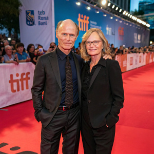 Ed Harris and Amy Madigan attending the Toronto International Film Festival. Red carpet event with festival banners and logos in the background.